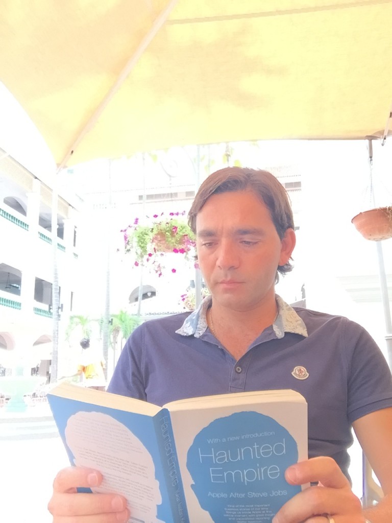 YIannis Misirlis reading the Haunted Empire at Raffles Hotel in Singapore